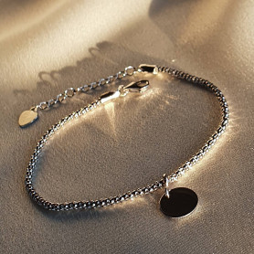 Браслет срібний Монетка на жгуті 000084