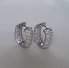Серьги серебряные с усыпкой из циркония бриллиантовой  огранки
