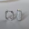 Серьги серебряные с усыпкой из циркония бриллиантовой  огранки