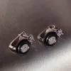 Серебряные серьги с черной керамикой и цирконием бриллиантовой огранки 003378