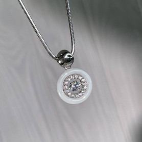 Підвіс срібний з білою керамікою і танцюючим цирконієм діамантового огранювання 006784